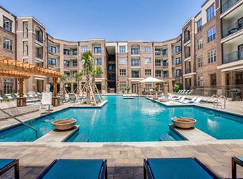 Resort-style swimming pool with cascading fountains